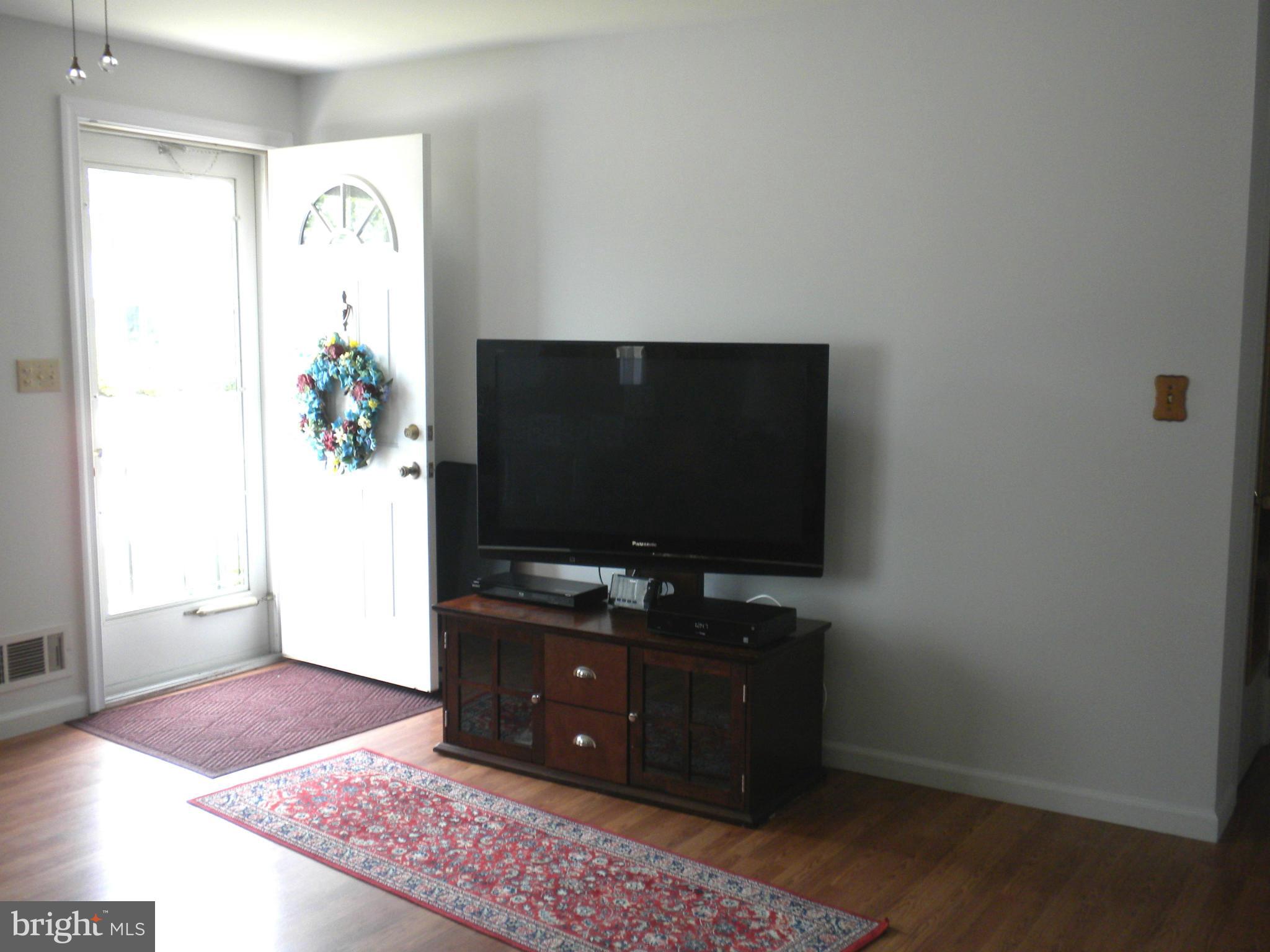 2114 Gaybrook Road Baltimore, MD 21244 - Photo 4 of 19 a living room with furniture and a flat screen tv
