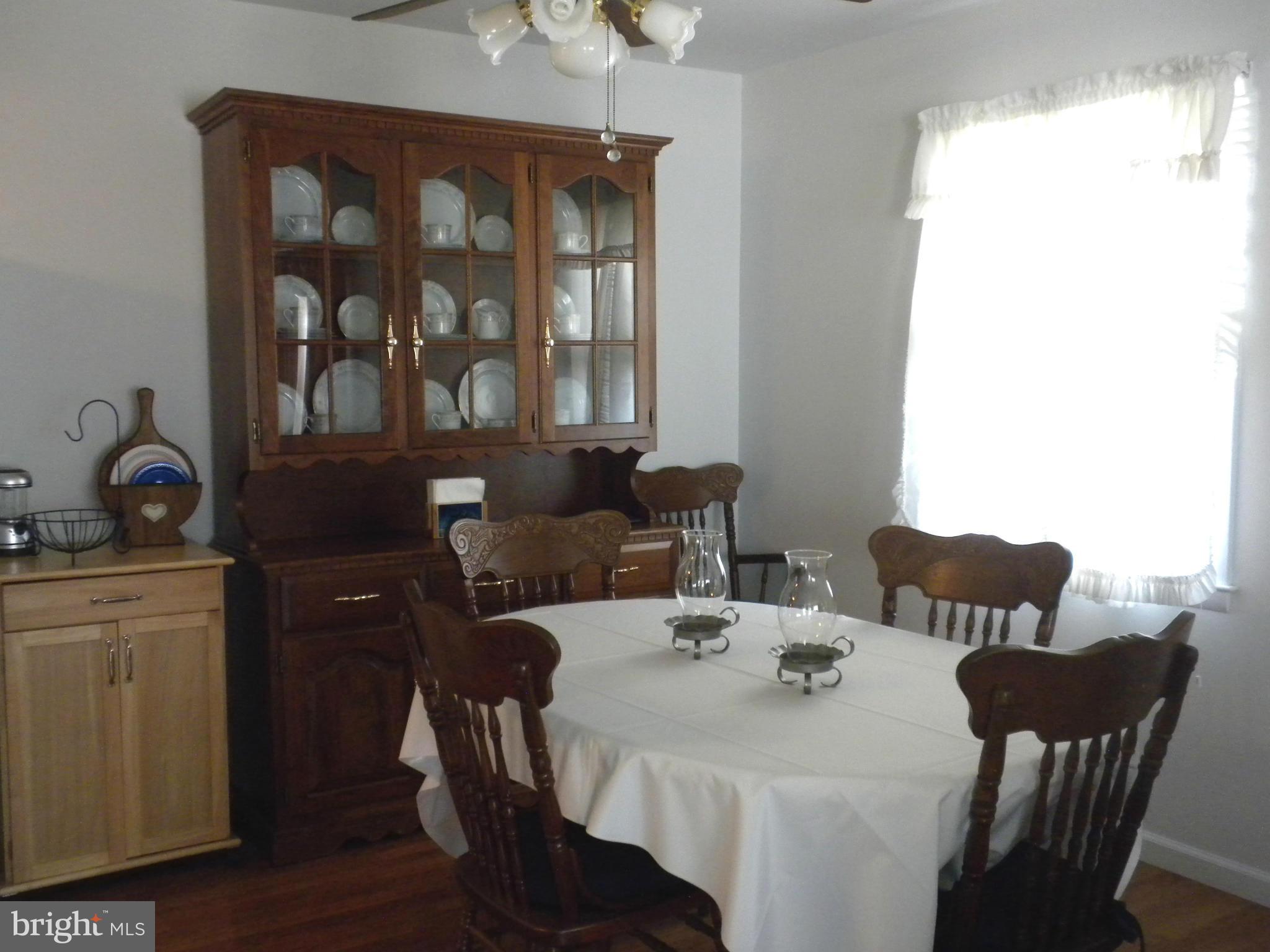 2114 Gaybrook Road Baltimore, MD 21244 - Photo 5 of 19 a view of a dining room with furniture and window