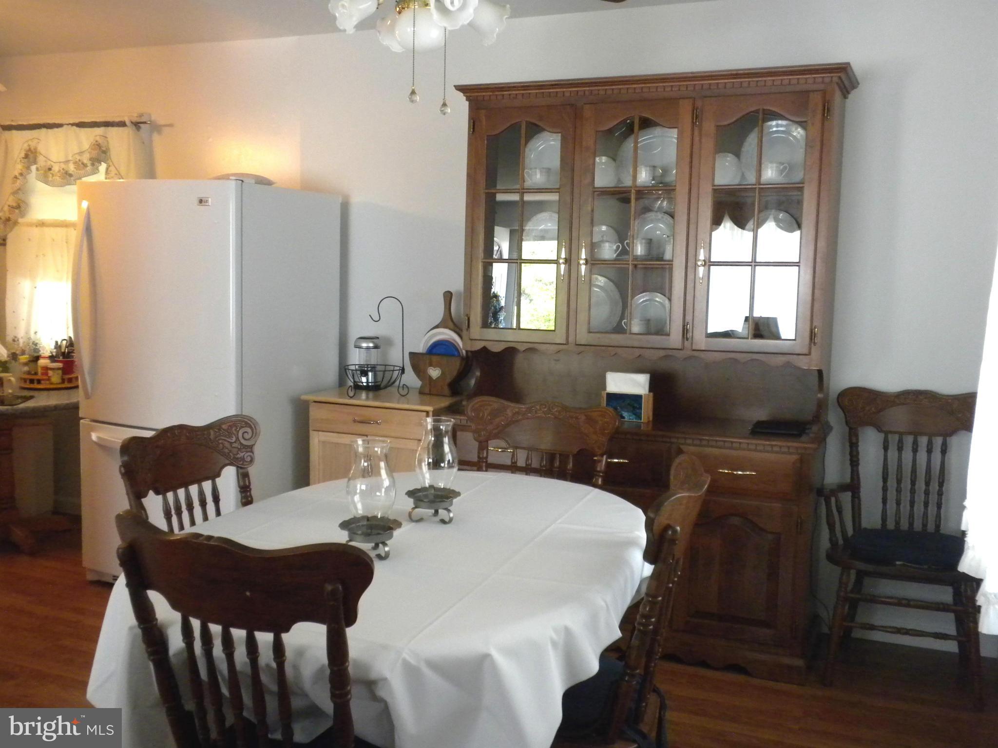 2114 Gaybrook Road Baltimore, MD 21244 - Photo 6 of 19 a view of a dining room with furniture window and outside view