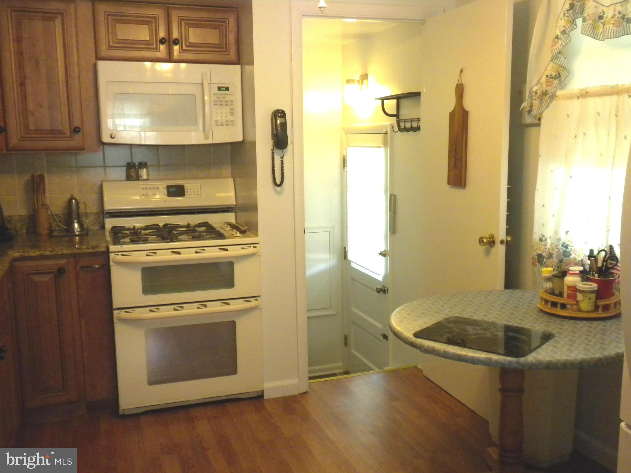 2114 Gaybrook Road Baltimore, MD 21244 - Photo 8 of 19 a kitchen with stainless steel appliances a stove a sink and a refrigerator