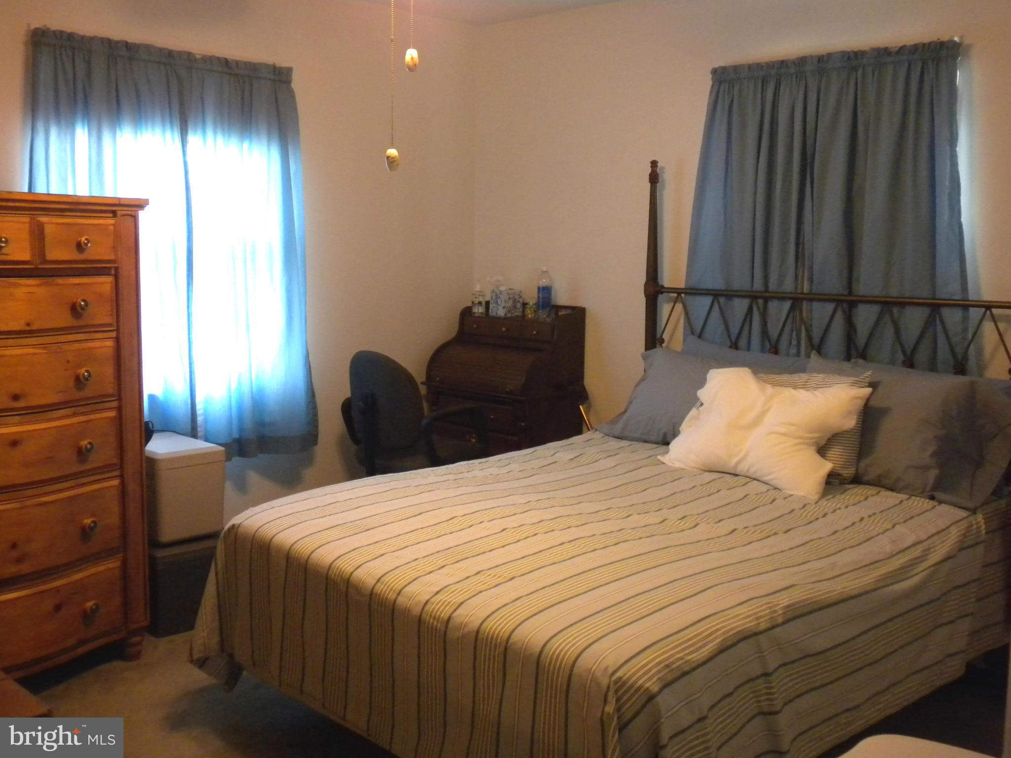 2114 Gaybrook Road Baltimore, MD 21244 - Photo 10 of 19 a bedroom with bed and a closet