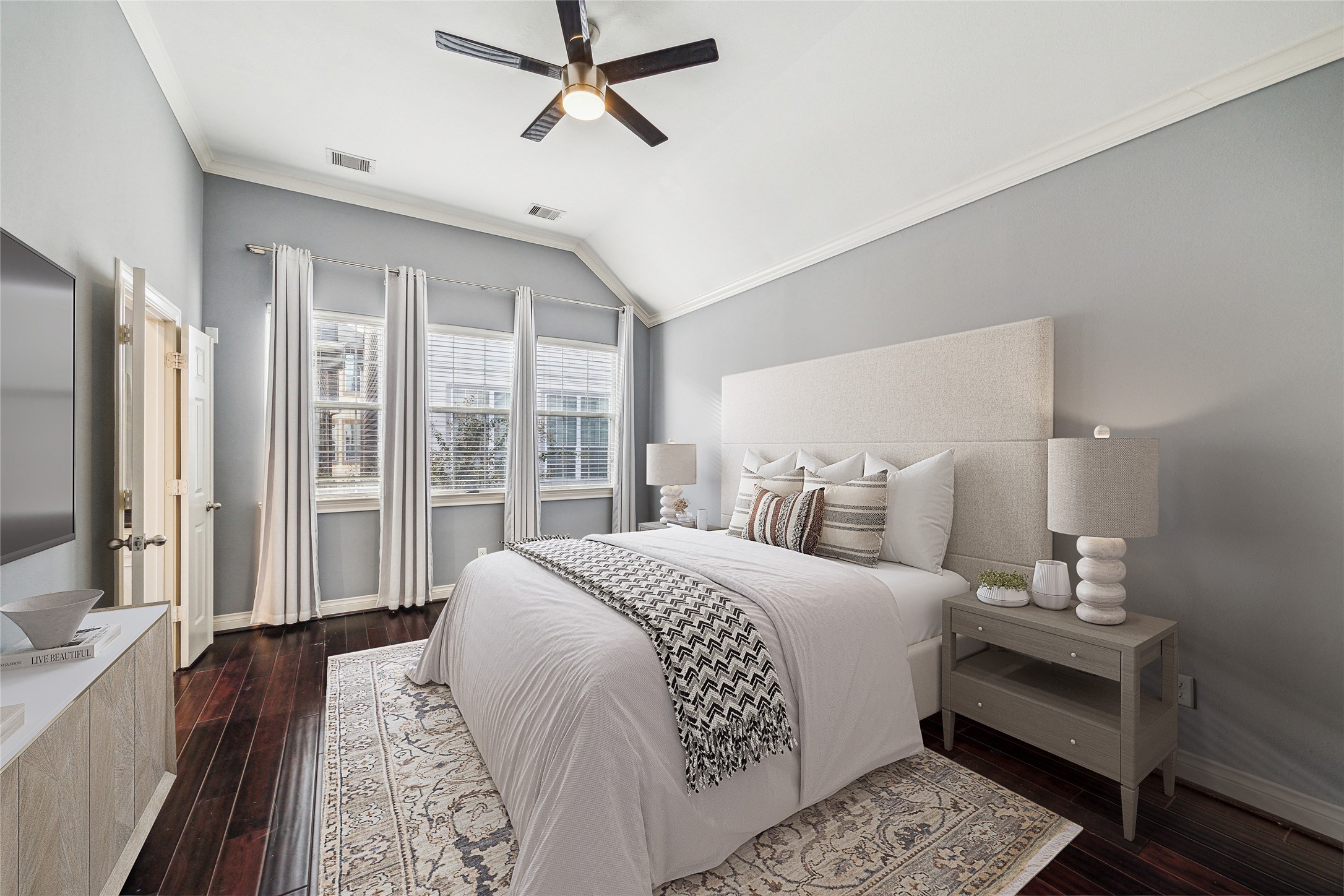 3432 Cline Street Houston, TX 77020 - Photo 1 of 22 a bedroom with a large bed and a flat tv screen