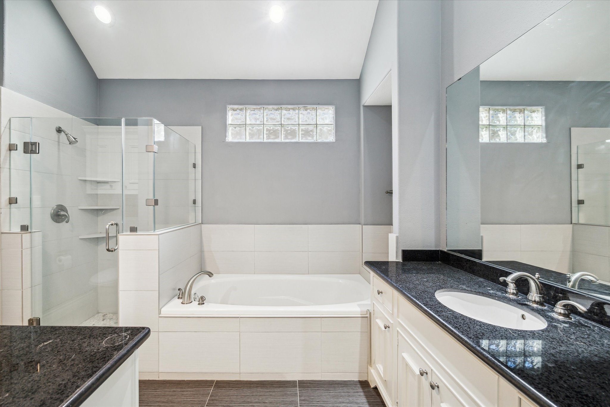3432 Cline Street Houston, TX 77020 - Photo 8 of 22 a bathroom with a granite countertop tub sink and mirror