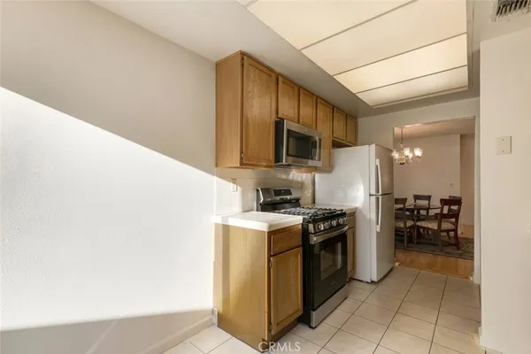 a living room with furniture and a lamp