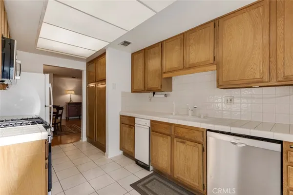 a living room with furniture a rug and a fireplace