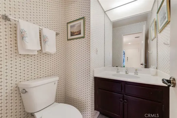 a bedroom with a bed couch and window