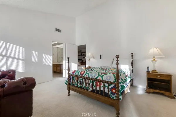 a bedroom with furniture and a dresser
