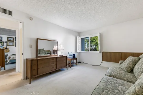 an aerial view of multiple houses with yard