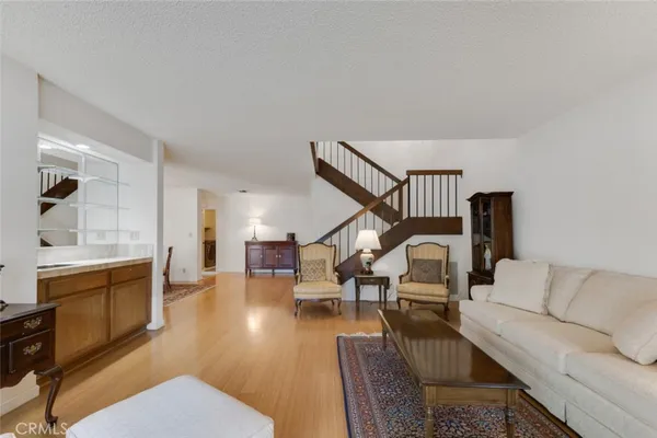 a view of a dining room with furniture and chandelier