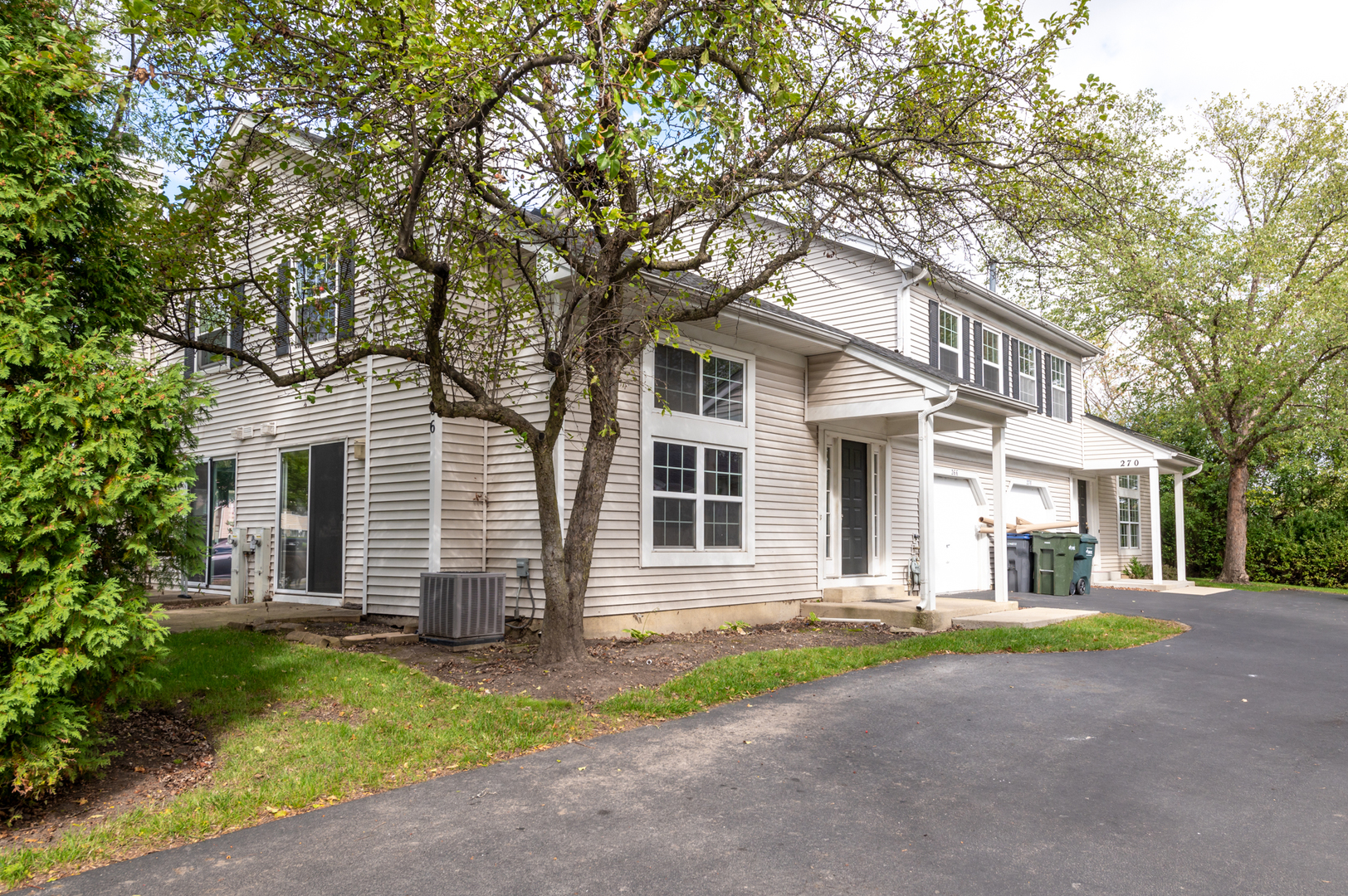 266 Butternut Lane Streamwood, IL 60107 - Photo 1 of 19 front view of a house with a yard