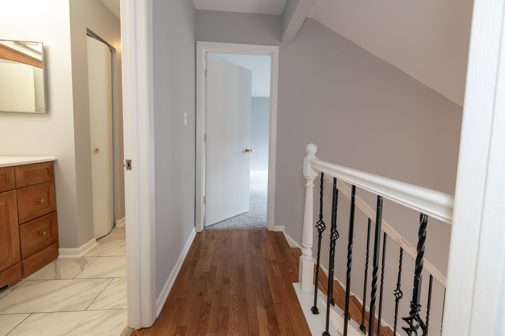 266 Butternut Lane Streamwood, IL 60107 - Photo 16 of 19 a view of a hallway with wooden floor