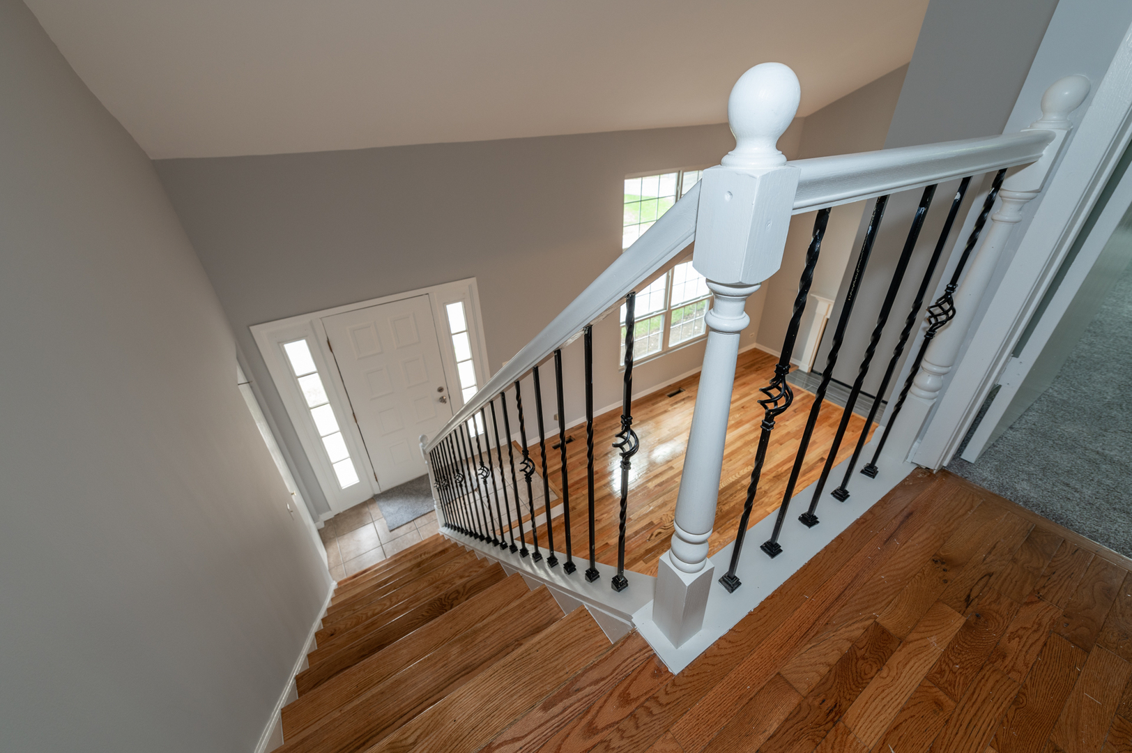 266 Butternut Lane Streamwood, IL 60107 - Photo 18 of 19 a view of staircase with wooden floor and fan