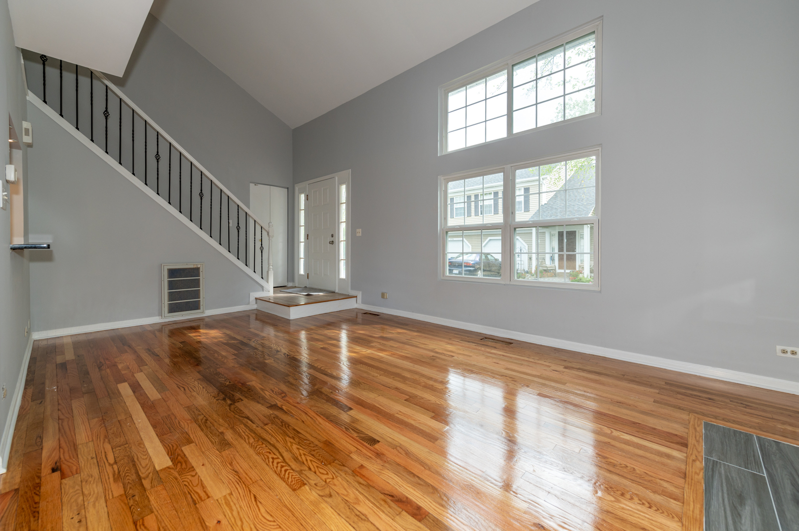 266 Butternut Lane Streamwood, IL 60107 - Photo 4 of 19 a view of an empty room with wooden floor and a window