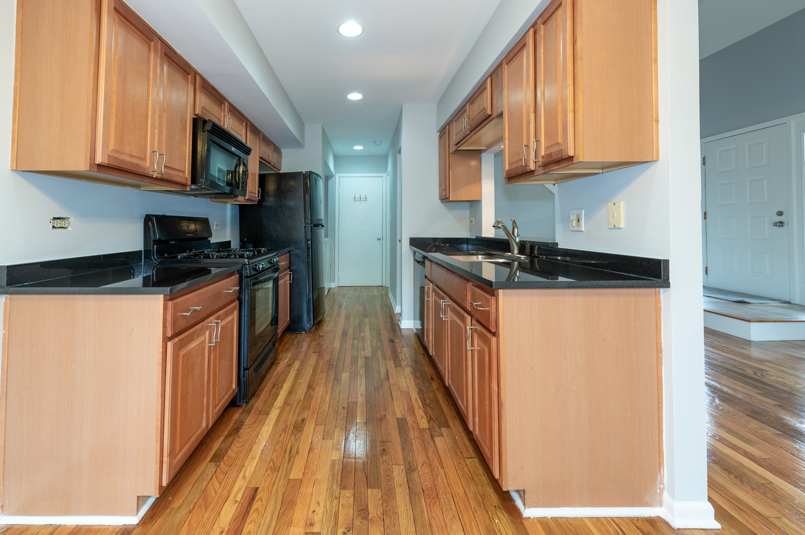 266 Butternut Lane Streamwood, IL 60107 - Photo 5 of 19 a kitchen with stainless steel appliances granite countertop a stove a sink and a microwave