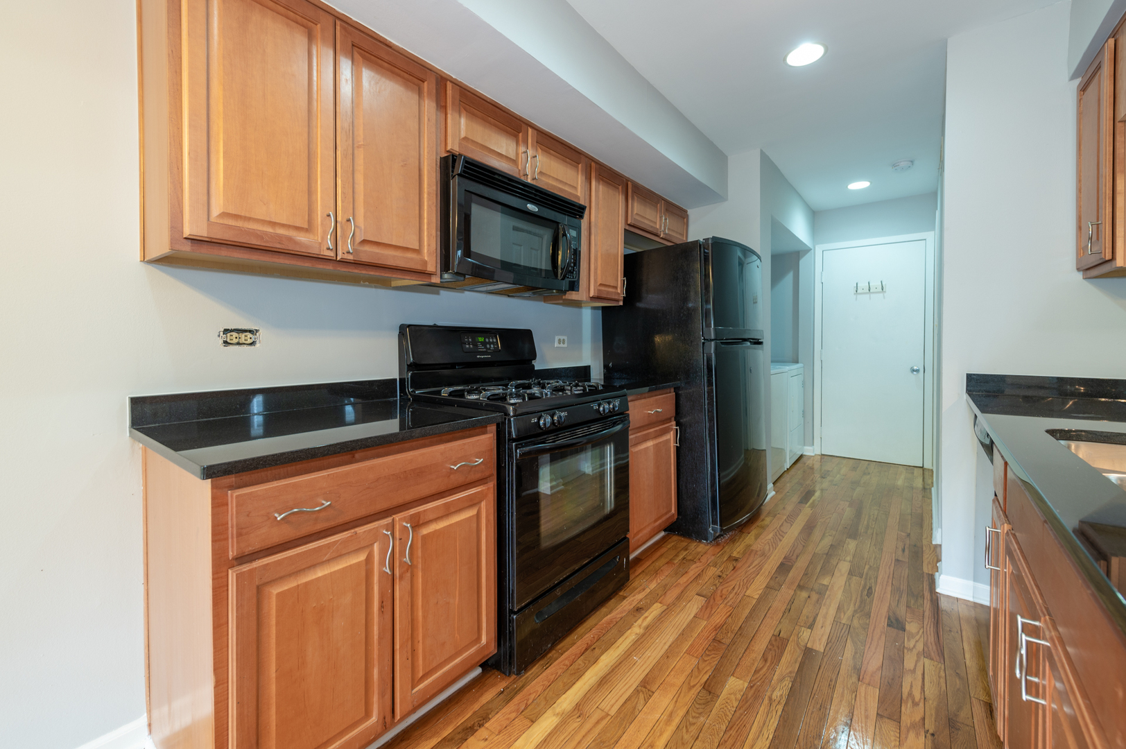 266 Butternut Lane Streamwood, IL 60107 - Photo 7 of 19 a kitchen with stainless steel appliances granite countertop a stove a sink and a microwave