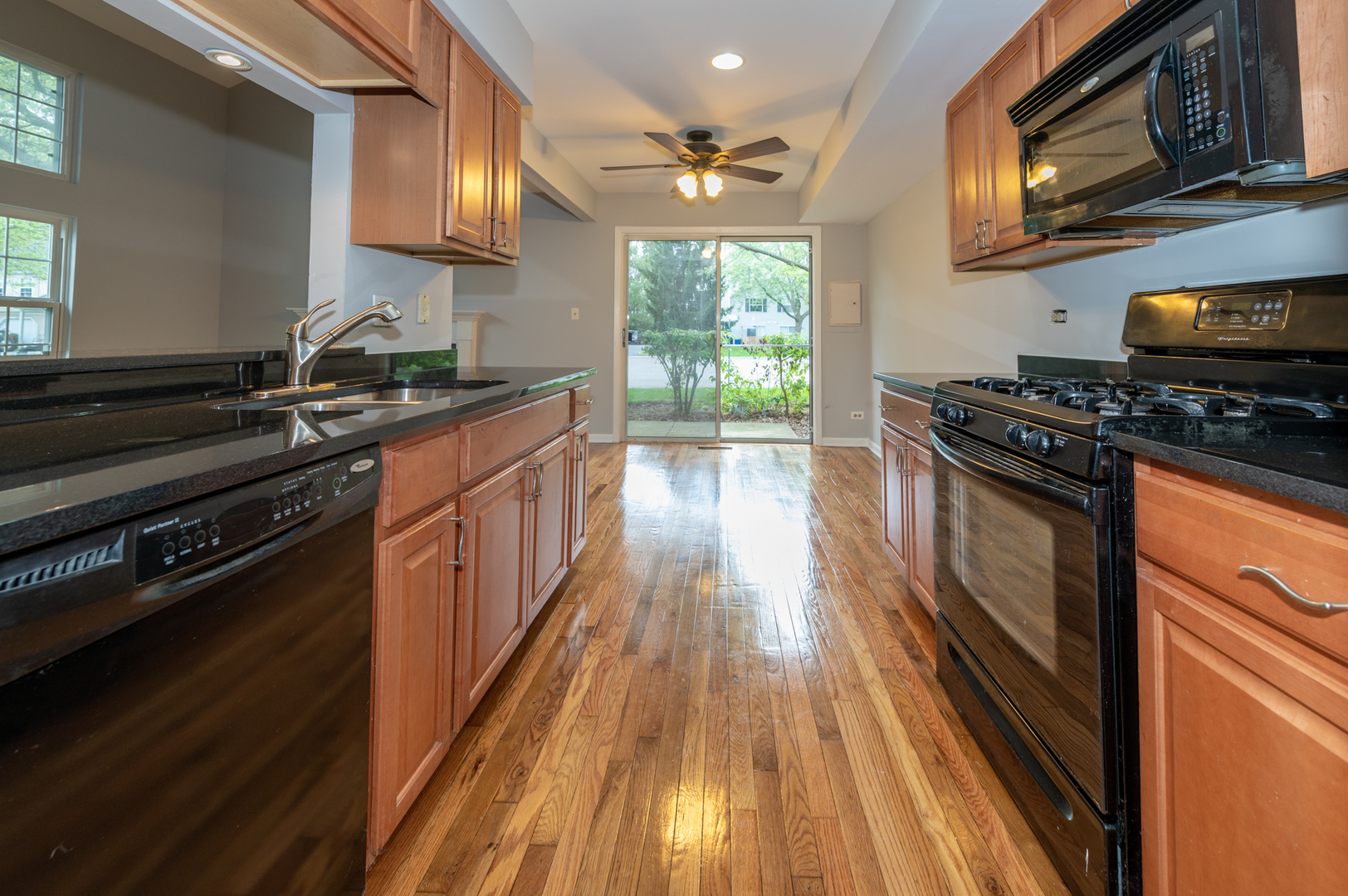 266 Butternut Lane Streamwood, IL 60107 - Photo 10 of 19 a kitchen with wooden floors and a stove
