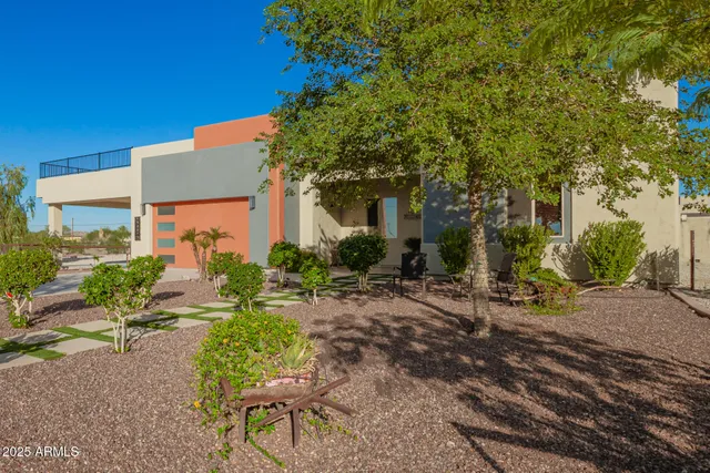 a work room with furniture and a potted plant