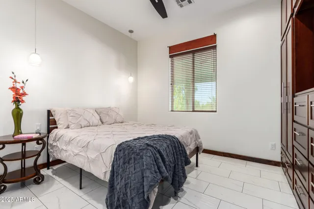 a view of a house with backyard and a small garden