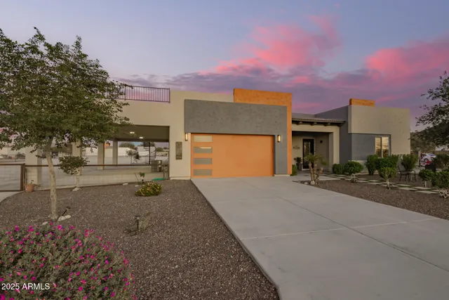 a view of a house with backyard and a street