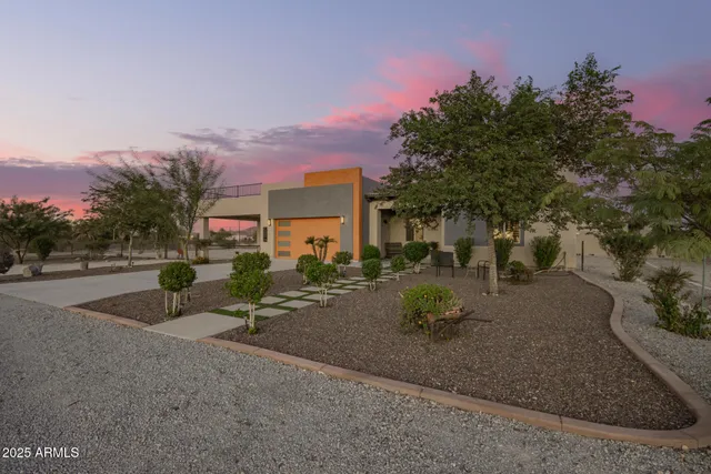 a backyard of a house with yard and outdoor seating