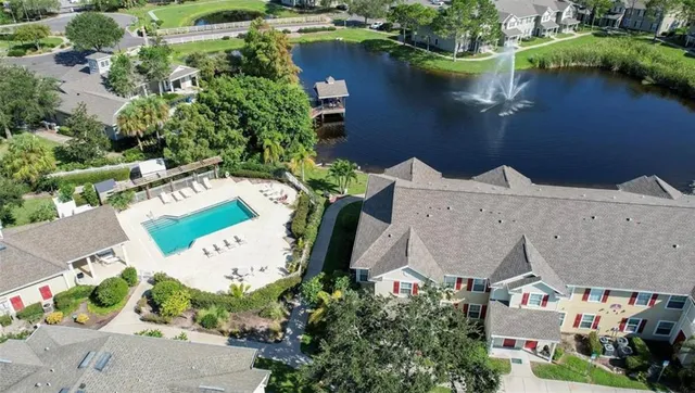 an aerial view of a house with a lake view
