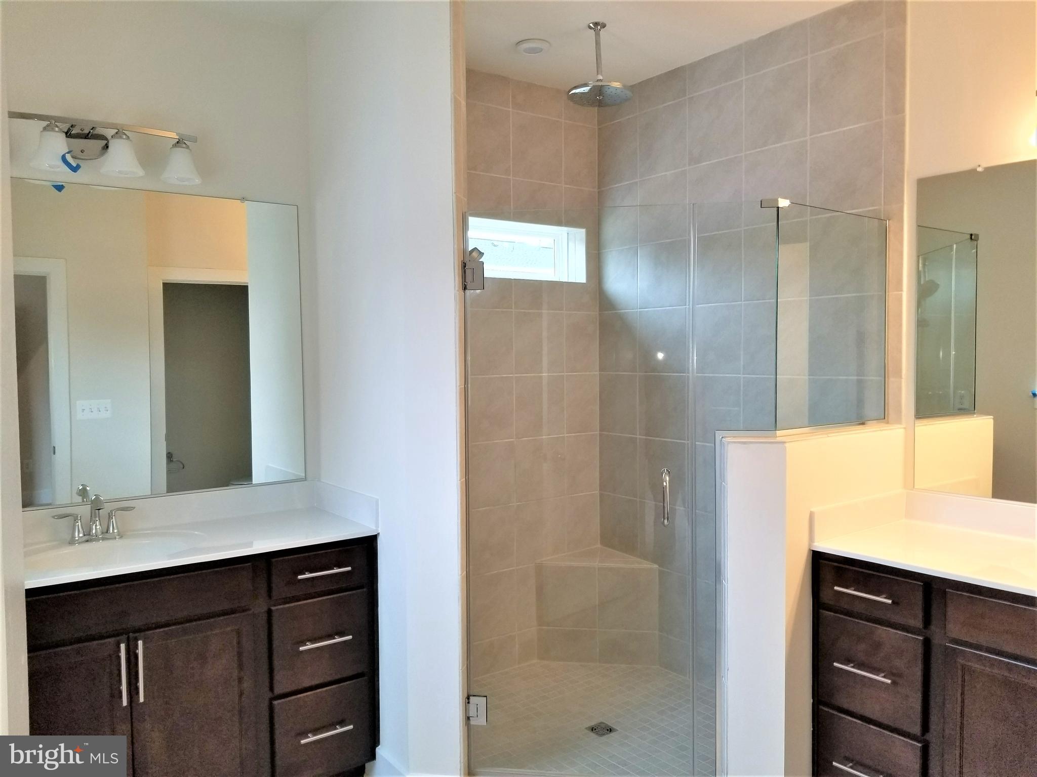 2638 Sequoia Lane Gambrills, MD 21054 - Photo 11 of 14 a bathroom with a shower sink and mirror