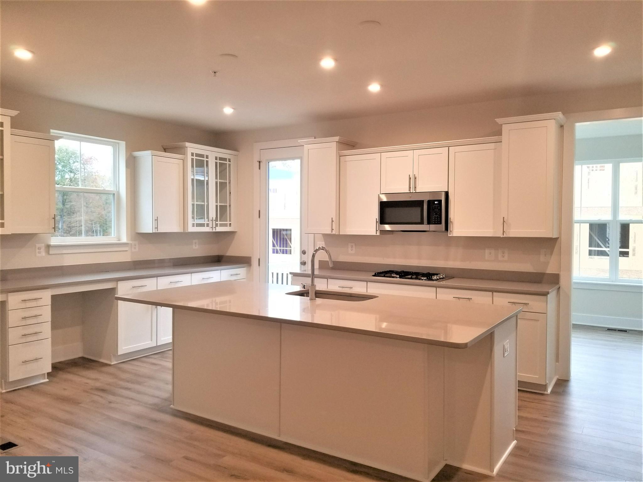 2638 Sequoia Lane Gambrills, MD 21054 - Photo 2 of 14 a kitchen with stainless steel appliances granite countertop a stove a sink and a microwave