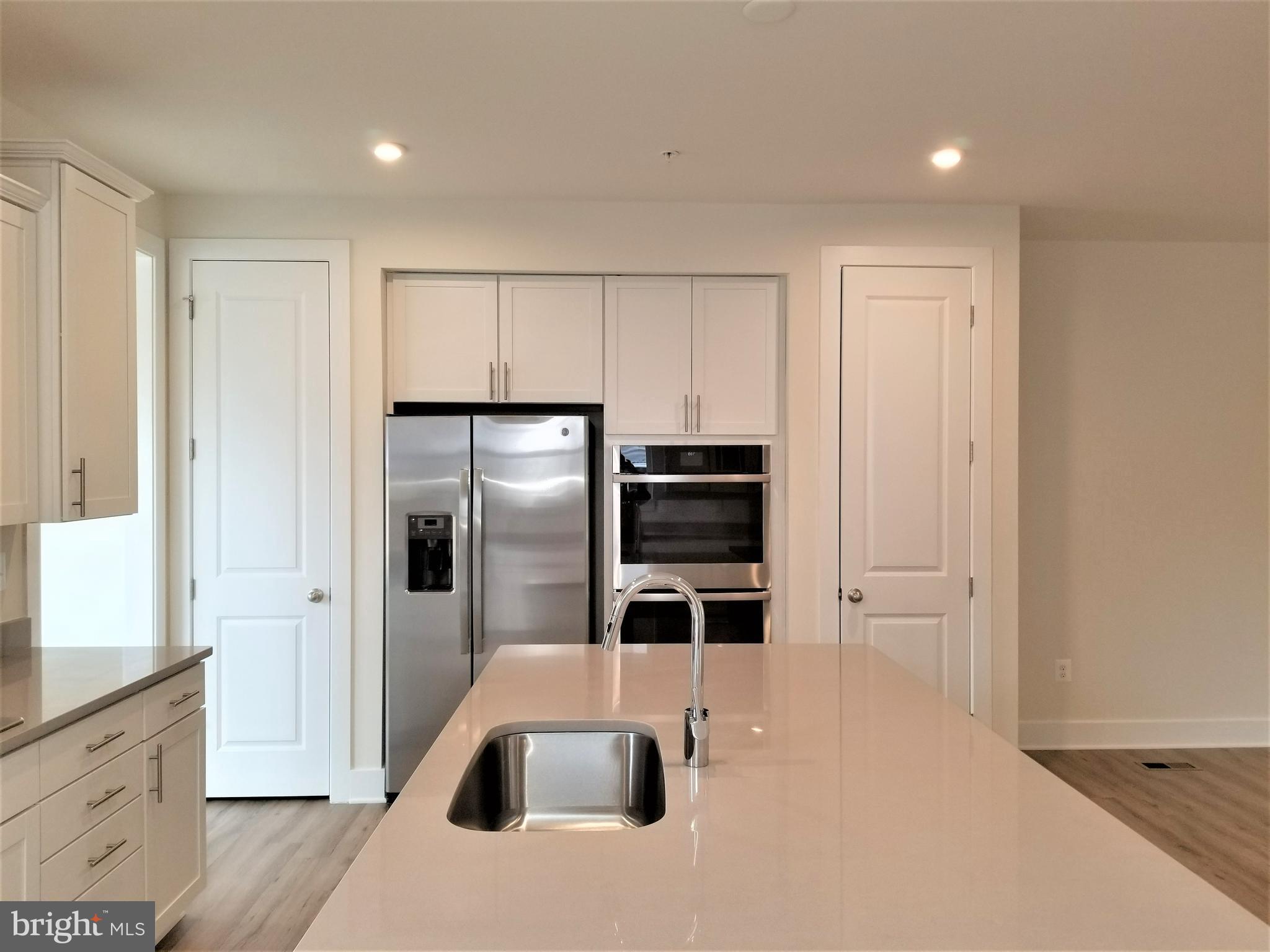 2638 Sequoia Lane Gambrills, MD 21054 - Photo 4 of 14 a kitchen with stainless steel appliances a refrigerator and a stove