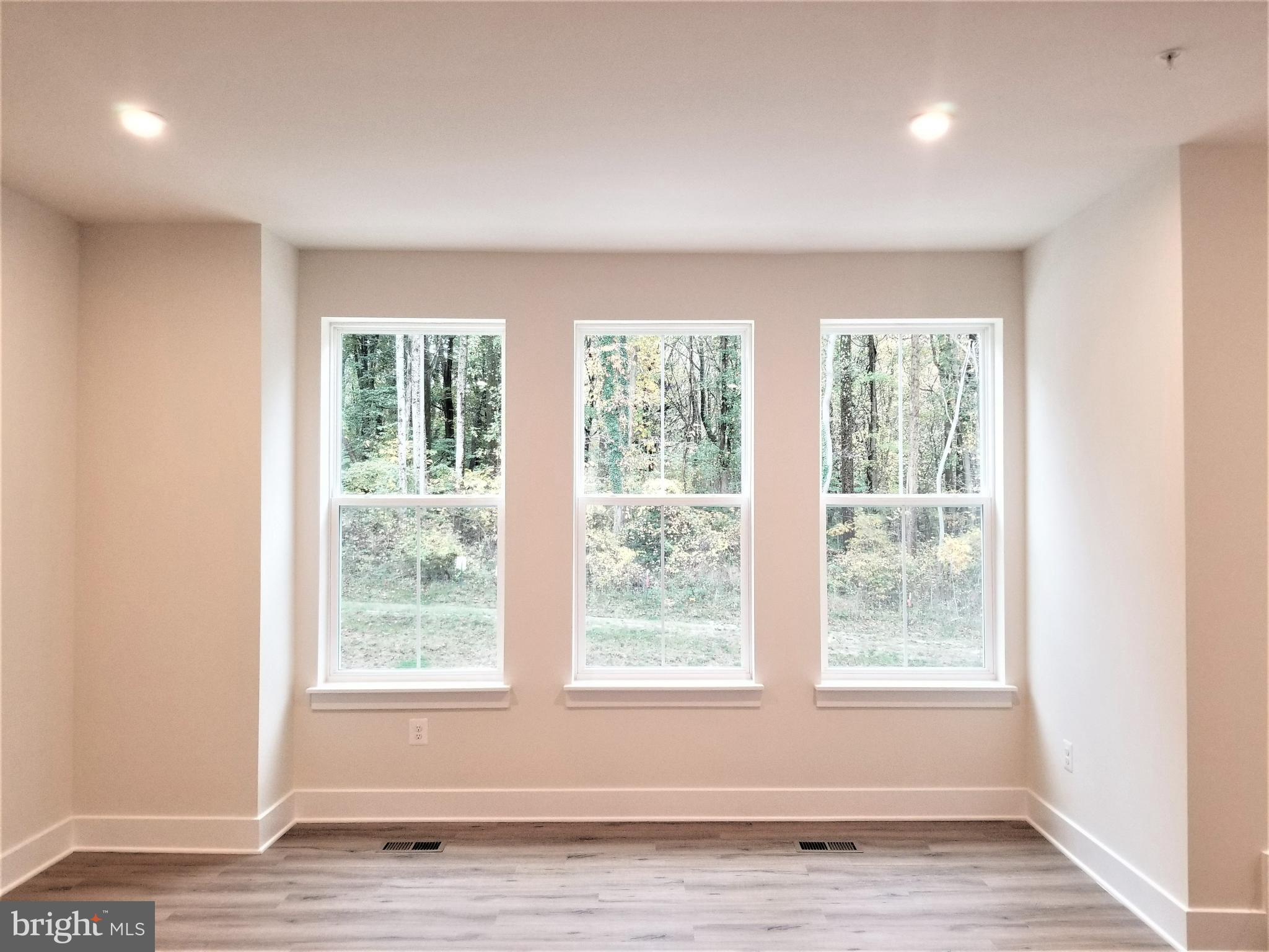 2638 Sequoia Lane Gambrills, MD 21054 - Photo 8 of 14 a view of an empty room with wooden floor and a window