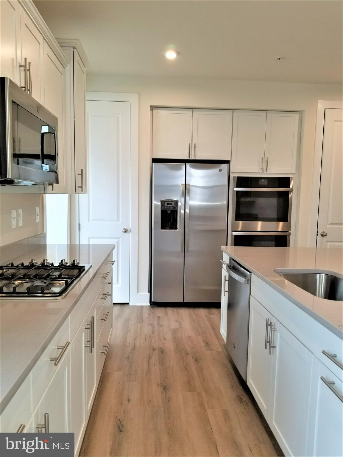 2638 Sequoia Lane Gambrills, MD 21054 - Photo 9 of 14 a kitchen with stainless steel appliances a refrigerator stove and microwave
