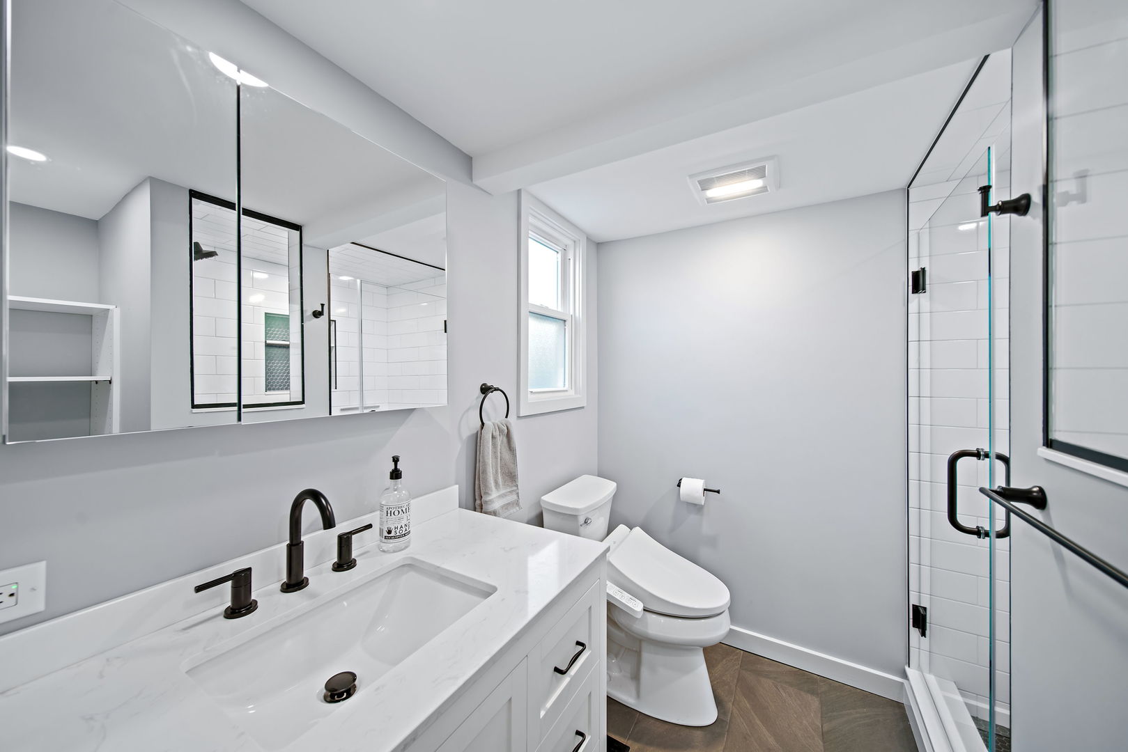 405 Marshall Road Northbrook, IL 60062 - Photo 14 of 27 a bathroom with a toilet sink and mirror
