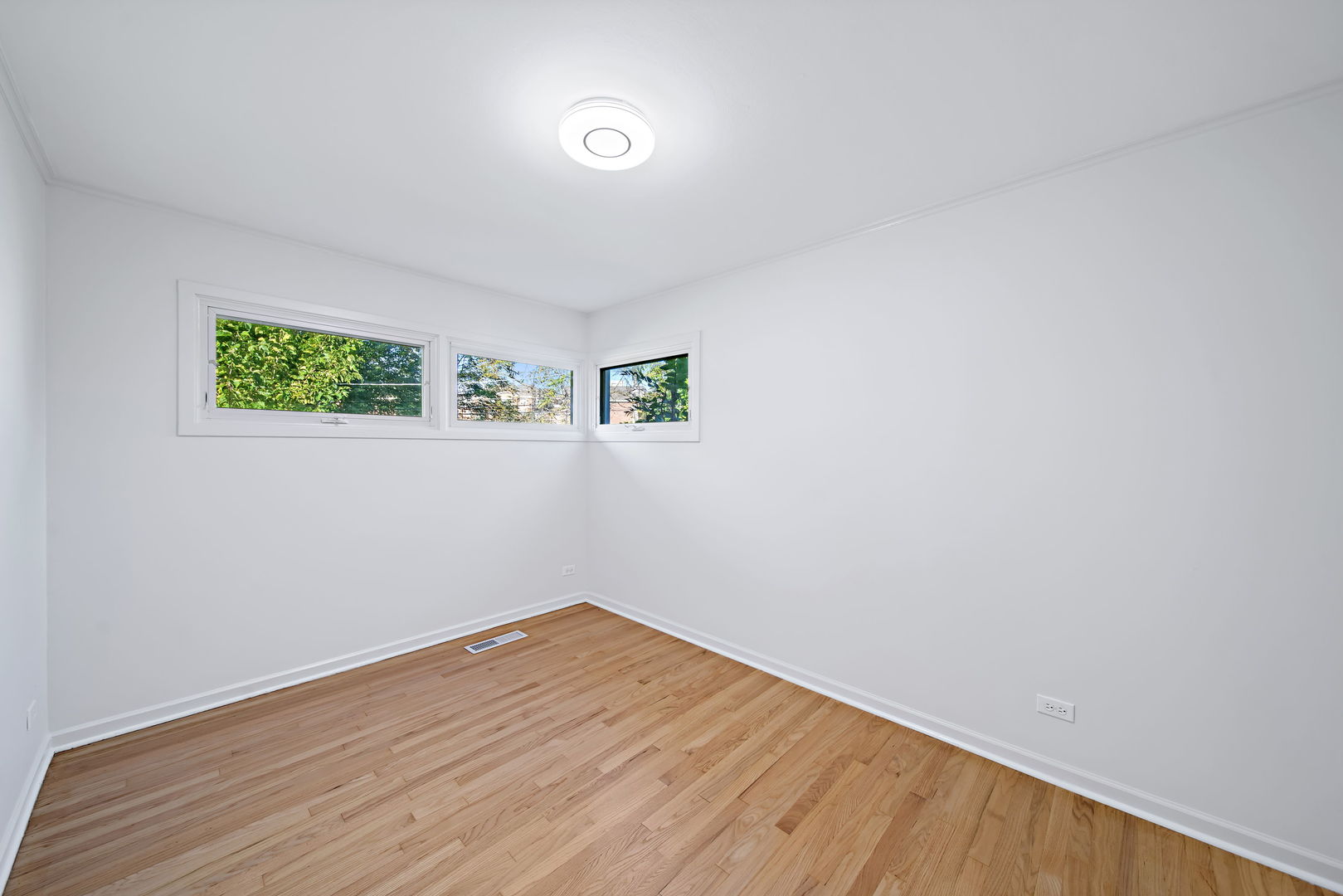 405 Marshall Road Northbrook, IL 60062 - Photo 17 of 27 a view of room with wooden floor and window