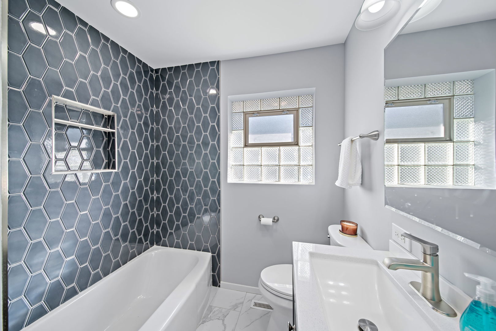 405 Marshall Road Northbrook, IL 60062 - Photo 19 of 27 a bathroom with a sink toilet tub and shower
