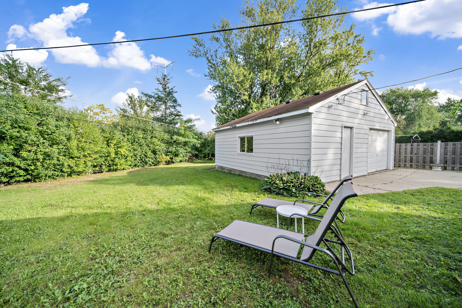 405 Marshall Road Northbrook, IL 60062 - Photo 25 of 27 a view of a backyard with plants and a garden