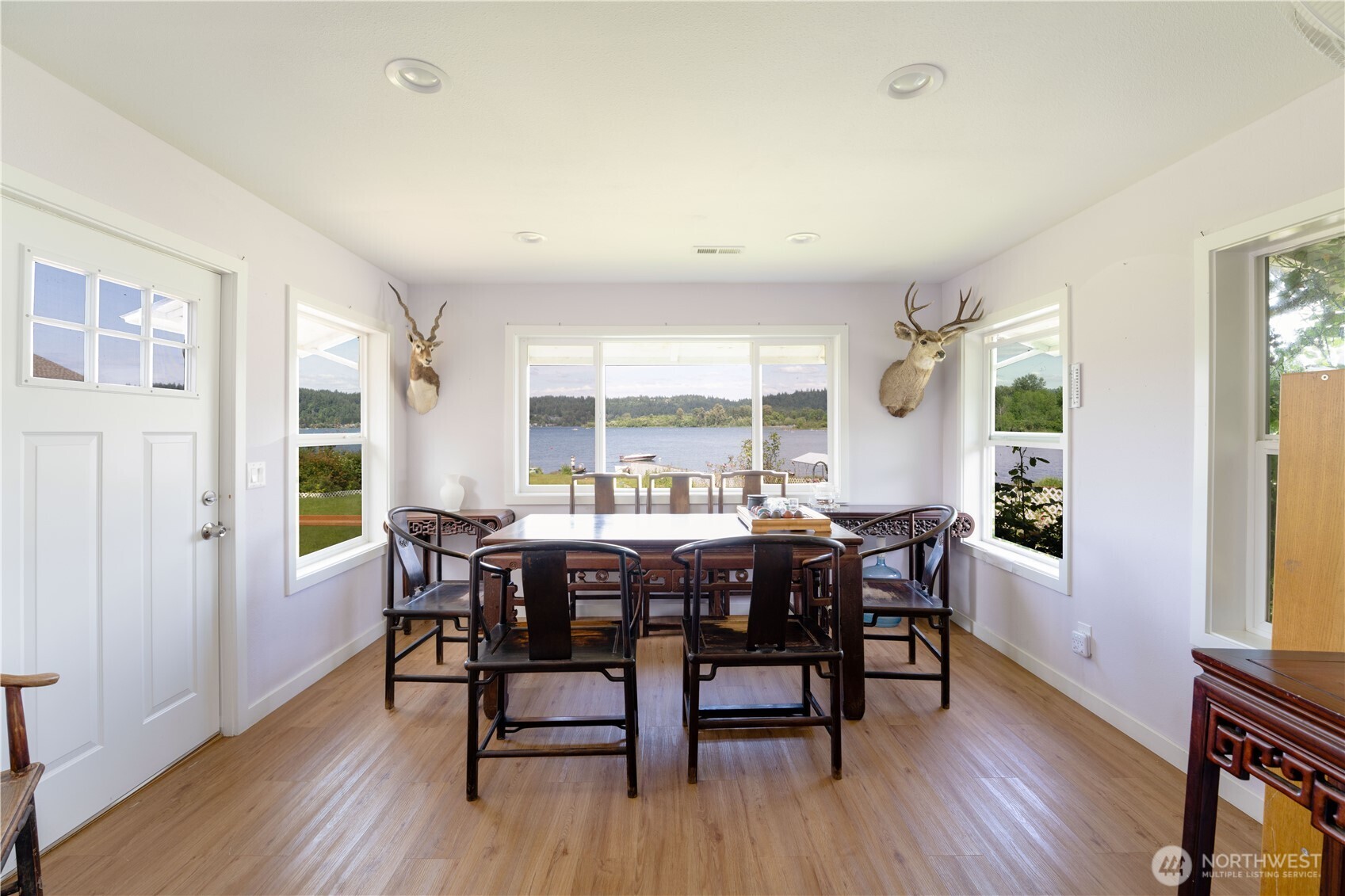 5104 Northwest Sammamish Road Issaquah, WA 98027 - Photo 12 of 24 a view of a dining room with furniture window and wooden floor