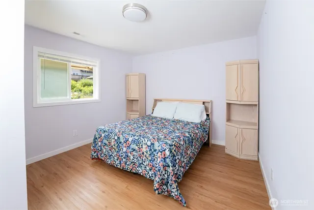 a bathroom with a double vanity sink mirror and toilet
