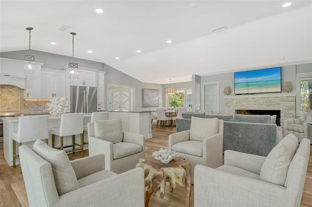 4852 Featherbed Lane Sarasota, FL 34242 - Photo 20 of 79 a living room with furniture and a fireplace