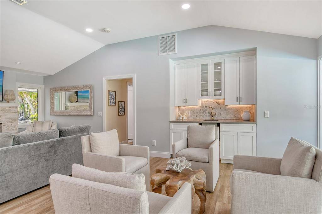 4852 Featherbed Lane Sarasota, FL 34242 - Photo 25 of 79 a living room with furniture and wooden floor