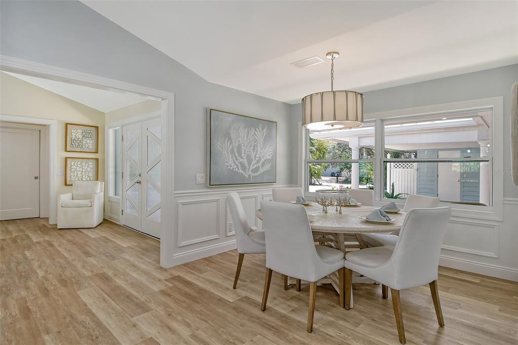4852 Featherbed Lane Sarasota, FL 34242 - Photo 31 of 79 a view of a dining room with furniture window and wooden floor