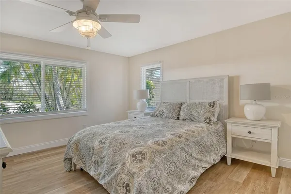 a bedroom with a bed and a table