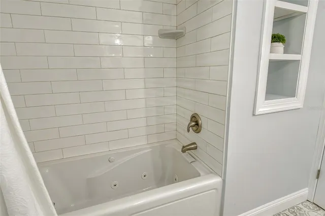 a view of a patio with couches and a potted plant