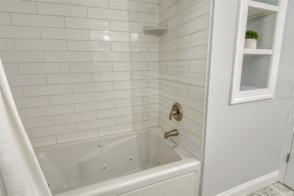 4852 Featherbed Lane Sarasota, FL 34242 - Photo 36 of 79 a bathroom with a bathtub