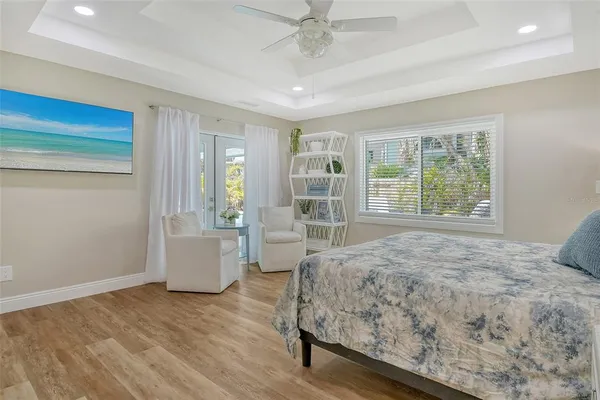 a view of a house with a yard and a tree