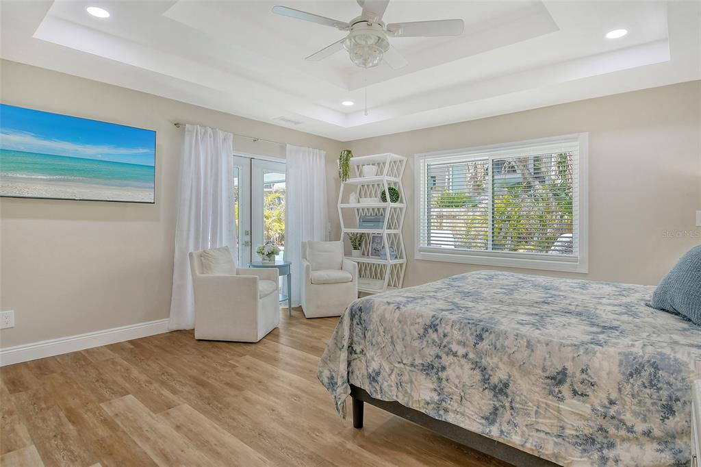 4852 Featherbed Lane Sarasota, FL 34242 - Photo 42 of 79 a spacious bedroom with a large bed and a window