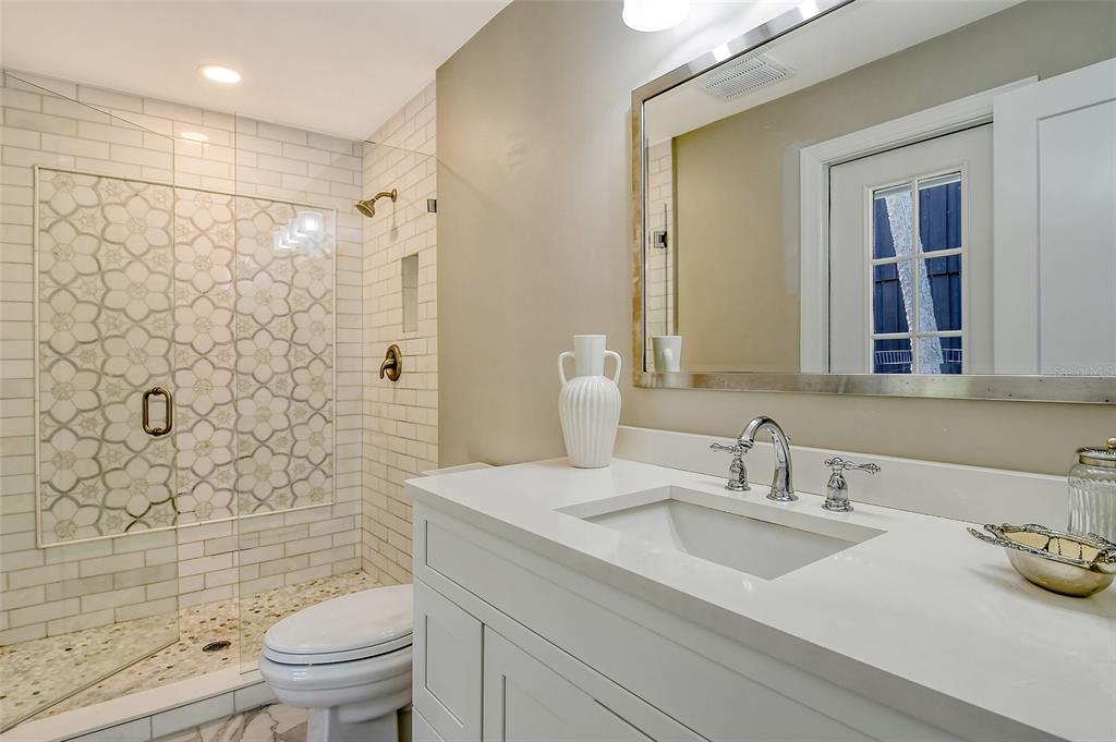 4852 Featherbed Lane Sarasota, FL 34242 - Photo 43 of 79 a bathroom with a sink toilet and shower