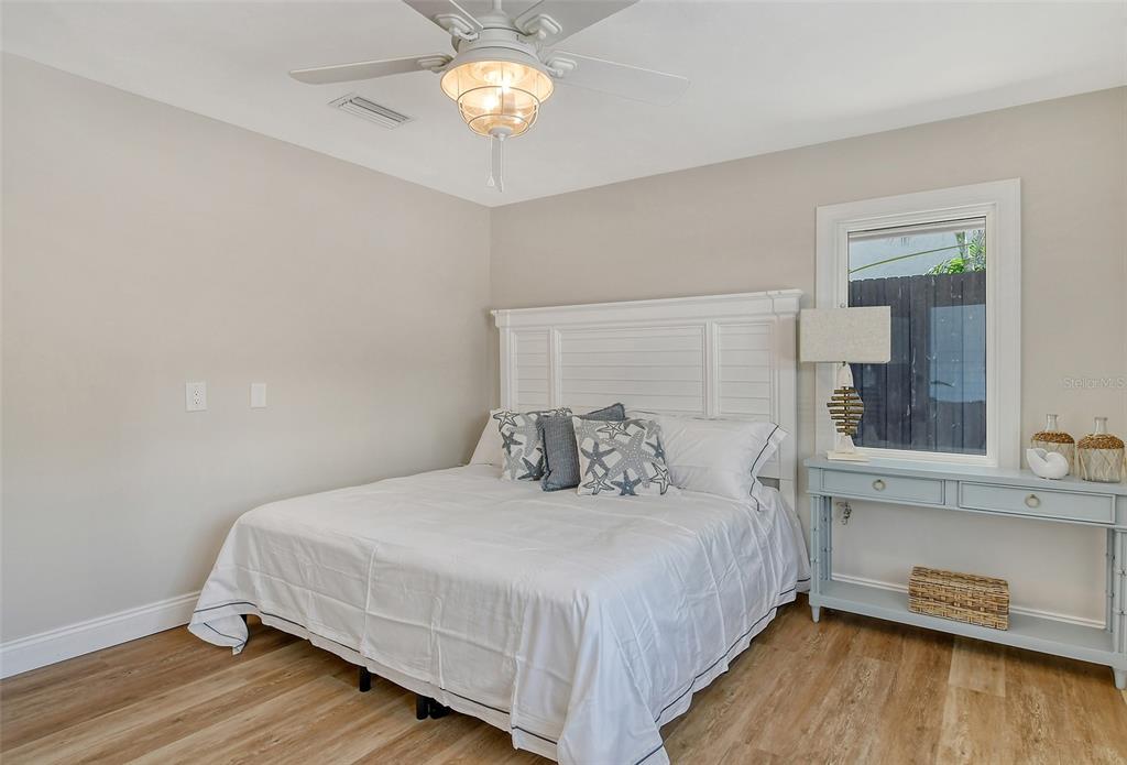 4852 Featherbed Lane Sarasota, FL 34242 - Photo 47 of 79 a bedroom with a bed and a table