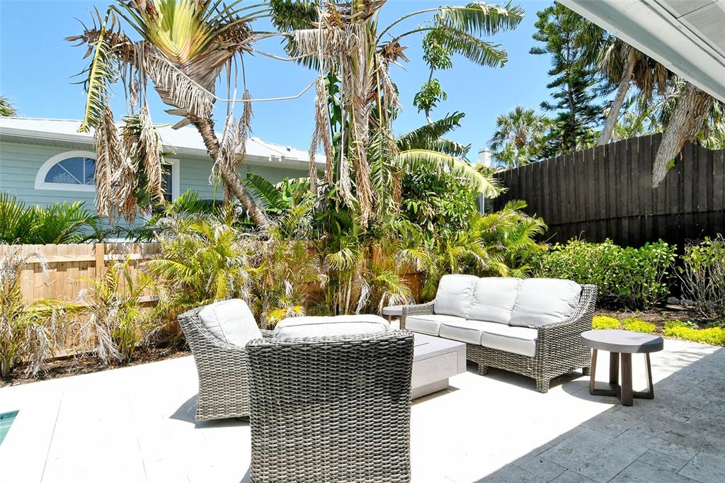 4852 Featherbed Lane Sarasota, FL 34242 - Photo 53 of 79 a view of a patio with couches and a potted plant