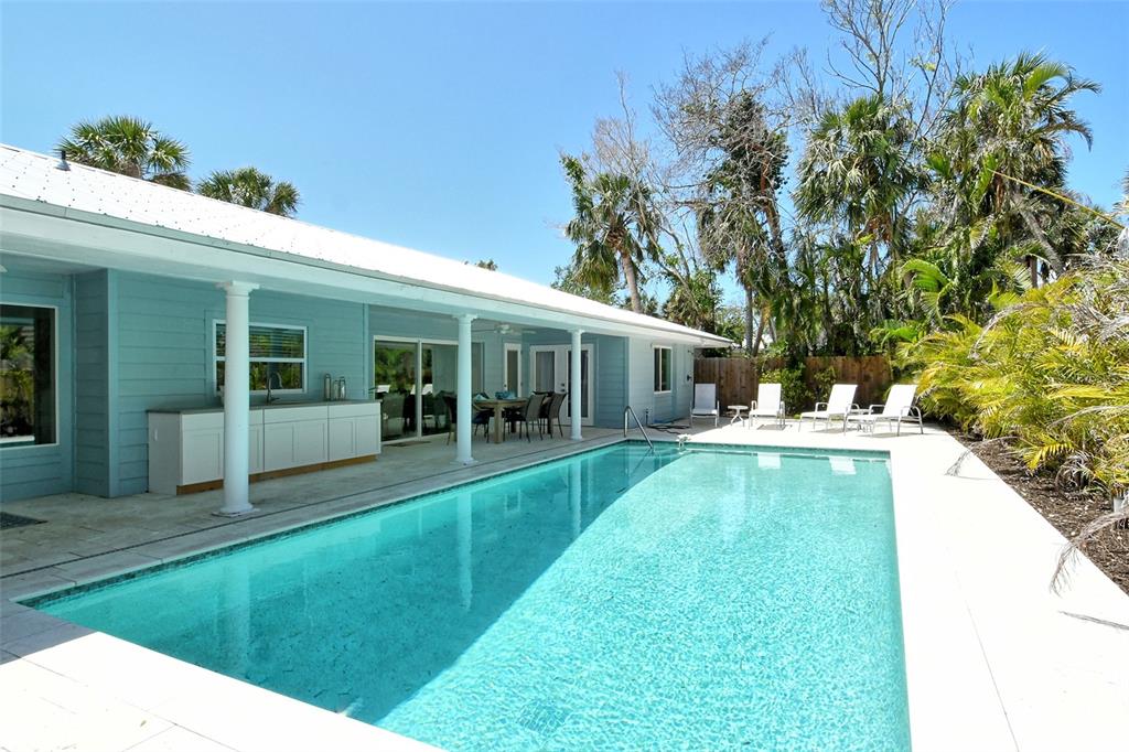 4852 Featherbed Lane Sarasota, FL 34242 - Photo 56 of 79 a view of an house with backyard space and sitting area