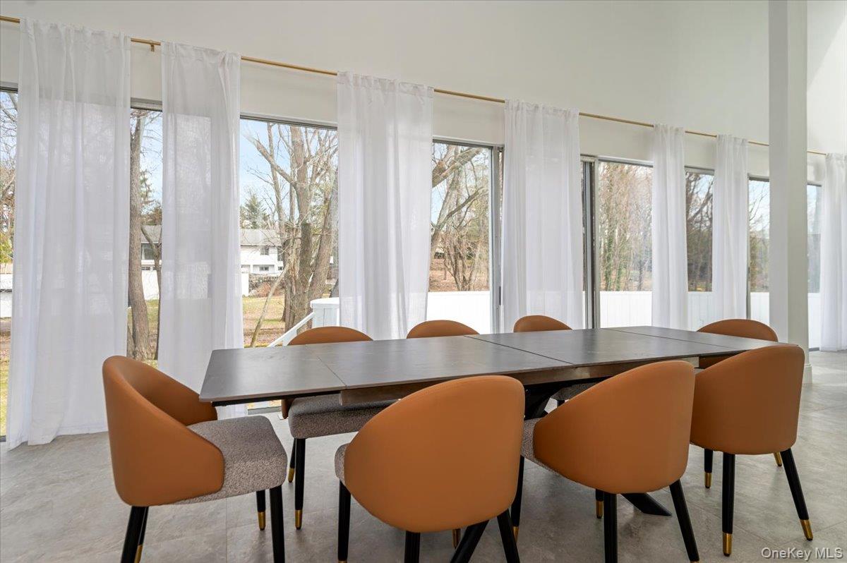 454 East Shore Road Great Neck, NY 11024 - Photo 12 of 48 a view of a dining room with furniture and window
