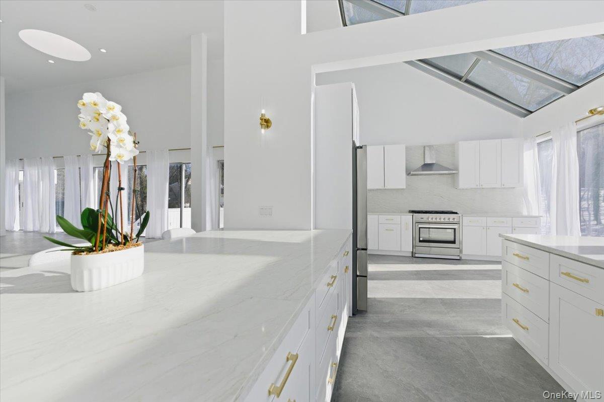 454 East Shore Road Great Neck, NY 11024 - Photo 16 of 48 a view of a kitchen with a sink and dishwasher in kitchen